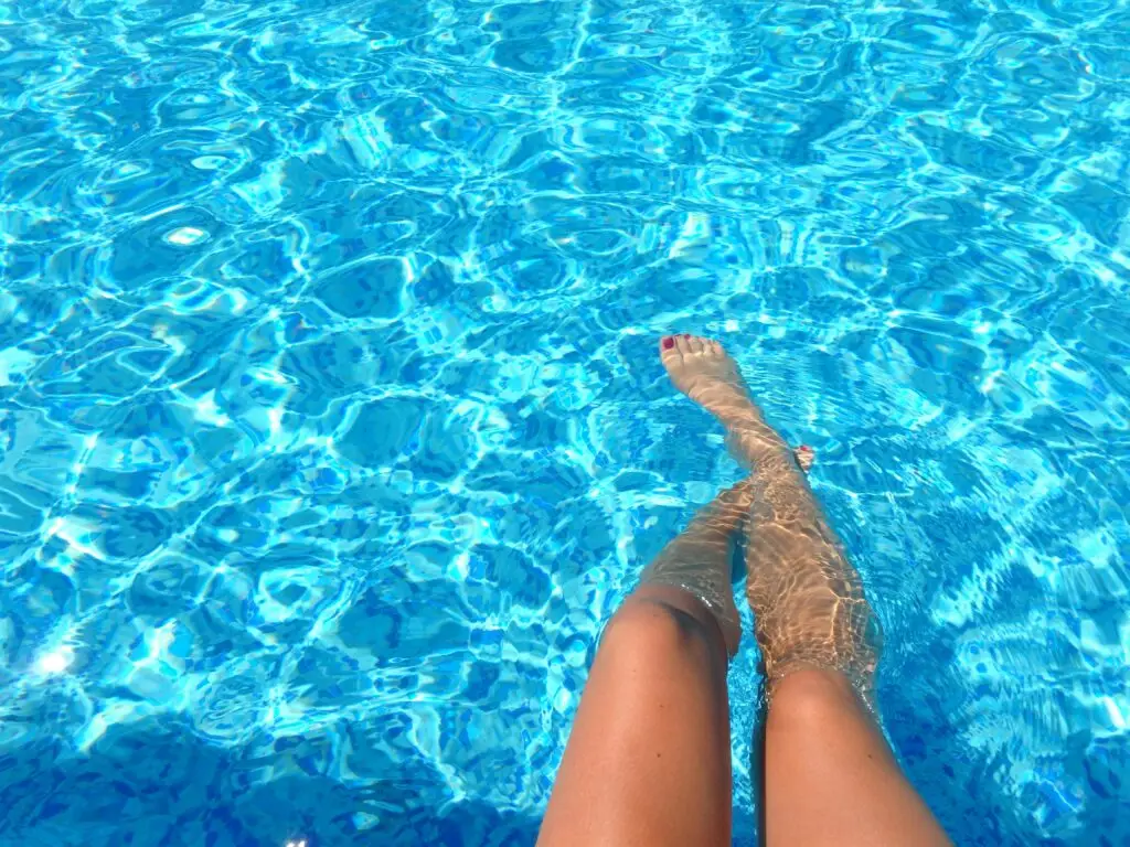 pexels-photo-835240-835240 A person relaxes in a swimming pool with clear blue water, capturing summer vibes.